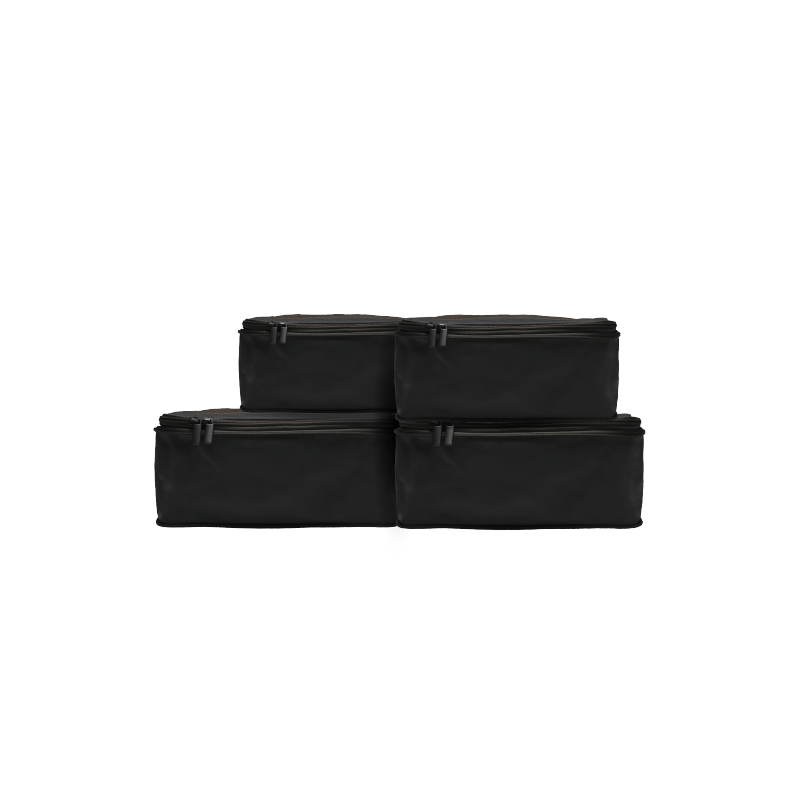 Set of Four / Black Hidden | This is a photo of a set of four compressible packing cubes in black